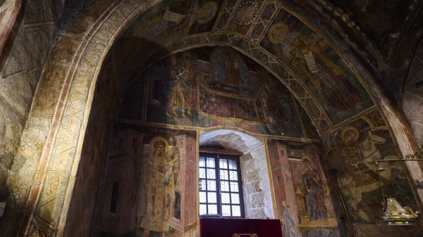 Richly decorated church interior with icons and an altar table covered with purple fabric, Thari Monastery, Moni Thari, near Gadouras Reservoir, remote mountain region, Rhodes, Dodecanese, Greek Islands, Greece, Europe