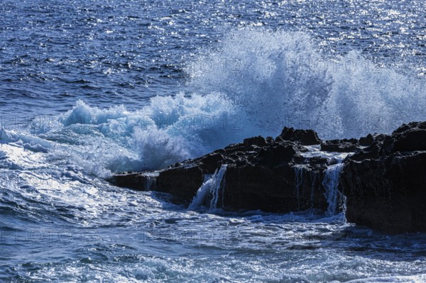 Rugged rocky coastline and foaming spray, on Stecci beach, near Capoliveri, Elba Island, Tuscan Archipelago National Park, Tuscany, Italy, Europe