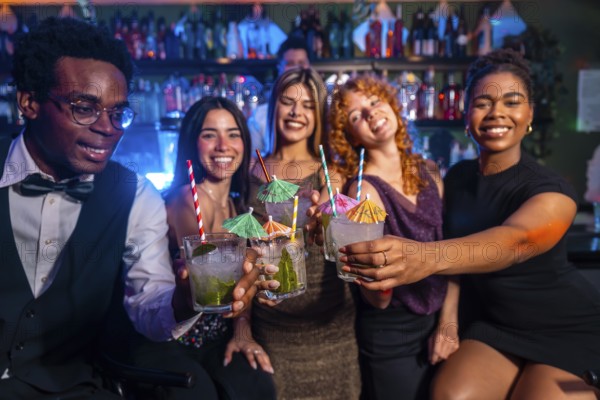 Diverse group of friends raising glasses of mojitos in celebration at a vibrant nightclub, enjoying nightlife and camaraderie