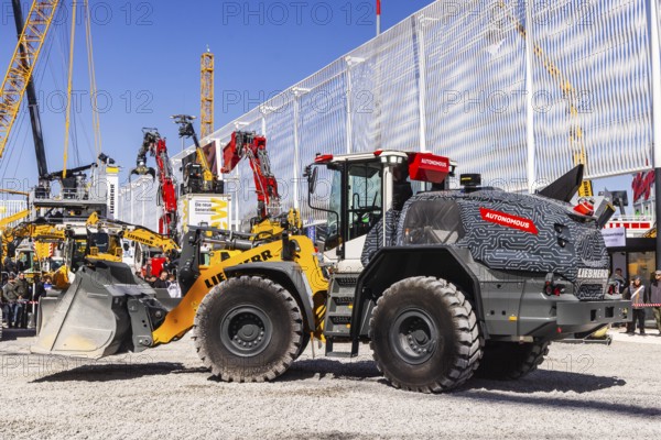 Presentation of autonomous vehicles. BAUMA Munich, 34th World's Leading Trade Fair for Construction Machinery, Building Material Machines, Mining Machines, Construction Vehicles and Construction Equipment. In 2025, the trade fair will attract around 600, 000 visitors from more than 200 countries and regions and 3601 exhibitors. Open-air area with exhibits from Liebherr. Munich, Bavaria, Germany, Europe