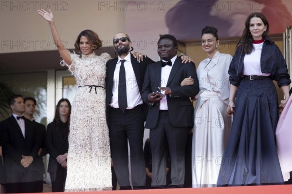 Cannes, France - 24.5.2024: Juliette Binoche, Jury President (not pictured) of the 78th Cannes Film Festival, and Jury Members (L-R) Halle Berry, Payal Kapadia, Alba Rohrwacher, Leila Slimani, Dieudo Hamadi, Hong Sang-soo (not pictured), Carlos Reygadas (not pictured), Jeremy Strong (not pictured) during the Closing Ceremony at the 78th Cannes International Film Festival. The film festival will take place from 13 to 24 May 2025
