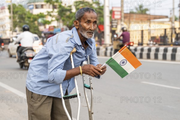 A differently abled person holds a tricolour as he take part in a rally, in soliderity with the Indian armed forces in Guwahati, India on 14 May 2025. A nationwide campaign Tiranga Yatra organized by the Bharatiya Janata Party (BJP) to honor the Indian armed forces' success in Operation Sindoor