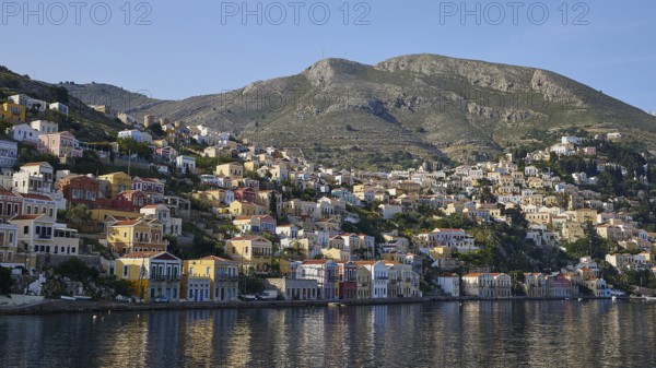 Coastal town with mountain views and water, Symi Town, Symi, Dodecanese, Greek Islands, Greece, Europe