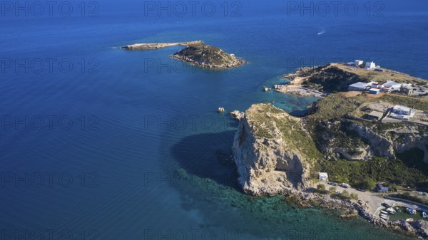 Aerial view of a cliff coast with buildings and blue water, Stegna Beach, Stegna viewpoint, Stegna, east coast, Rhodes, Dodecanese, Greek Islands, Greece, Europe