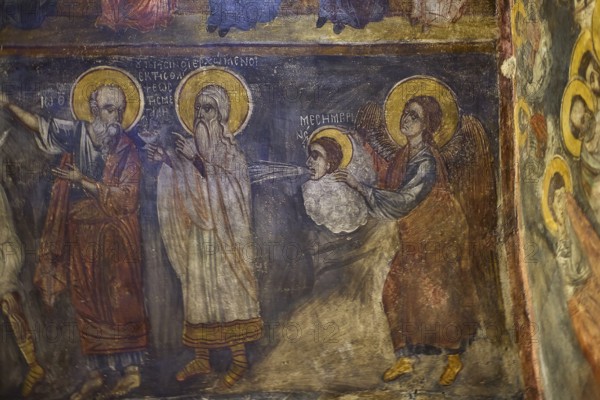 Holy figures in a fresco, one blessing a child on a cloud, winged and symbolically depicted, Easter 2025, Church of the Dormition of the All-Holy God Bear, Kimisis tis Theotokou, Asklipio, Rhodes, Dodecanese, Greek Islands, Greece, Europe