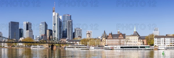 Frankfurt skyline skyscrapers with banks on the river Main panorama with excursion boats and Eiserner Steg in Frankfurt, Germany, Europe