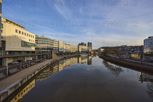 River Saar, modern architecture, trees, reflections on the water surface, fashion shop, Primark, evening light, blue sky, cirrostratus clouds, footbridge, Berlin Promenade, Willi Graf Ufer, Saarbrücken, state capital, Saarbrücken Regional Association, Saarland, Germany, Europe