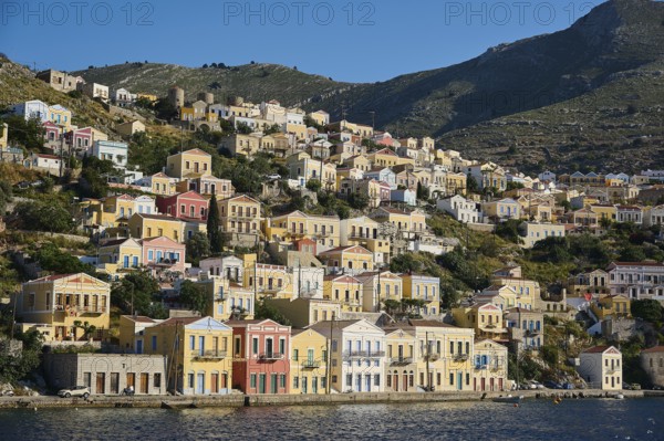 Colourful houses on a hilly shore, Symi Town, Symi, Dodecanese, Greek Islands, Greece, Europe
