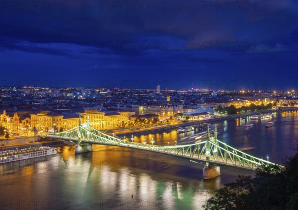 Evening panorama of Budapest with the Danube and the Liberty Bridge in the foreground