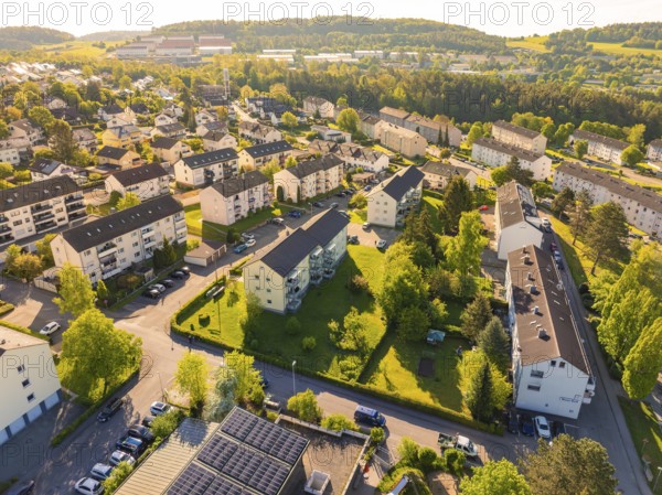 Aerial view of a residential area with numerous houses and green landscape on a sunny day, Calw, Black Forest, Germany, Europe