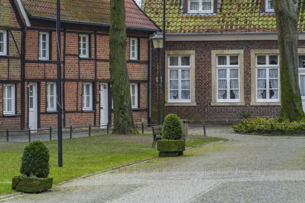 Small half-timbered town with brick houses and trees, quiet and charming atmosphere, billerbeck, münsterland, germany