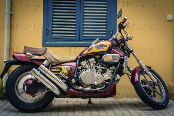 Honda Magna V45 motorcycle parked in front of a building