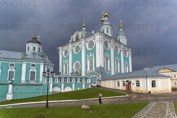 SMOLENSK, RUSSIA, APRIL 21, 2018: Uspensky cathedral against a background of dark thunderclouds. Smolensk, Russia. The end of April