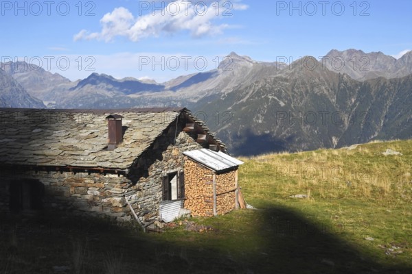 Light and shadows near a hut, Alpe Arcoglio, Valmalenco, Valtellina, Lombardy, Italy, Europe