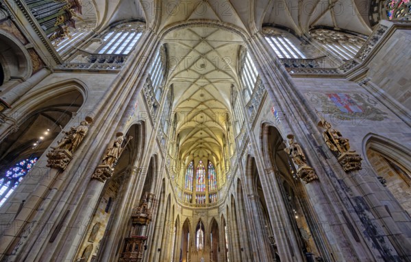 Majestic Gothic Saint Vitus cathedral interior with high ceilings, arches, and light casting shadows, Cathedral of Saints Vitus, Prague, Czech Republic, Europe