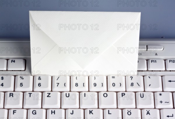 The keyboard of a computer and an envelope. Communication via e-mail, The keyboard of a computer and an envelope. Communication via e-mail. Austria