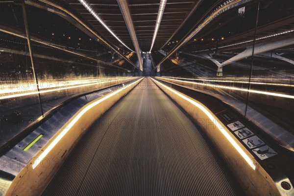 Symmetrical escalator with illuminated handrail in modern surroundings, Liège-Guillemins railway station, Liège-Guillemins, Belgium, Europe