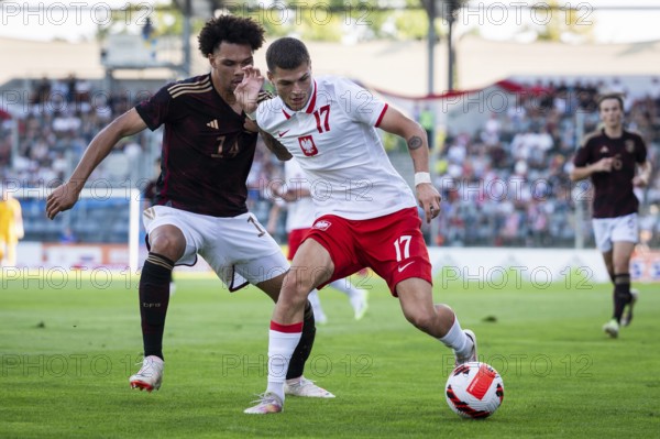 LEGNICA, POLAND - SEPTEMBER 11, 2023: Friendly football match under 20 Elite League Poland vs Germany 1:1. In action Nnamdi Collins (L) Marcel Blachewicz (R).