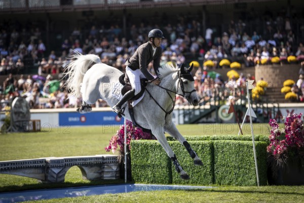 Donald Whitaker of Great Britain and riding Millfield Colette compete in the first round of the 1.60m CPKC International during the Spruce Meadows Masters, presented by Rolex, in Calgary, Alberta, Canada, North America