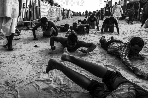 People crawling religious ritual ganga sagar kolkata west bengal India Asia