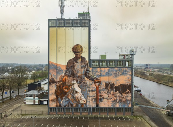 LOCHEM, NETHERLANDS, JANUARY 20, 2024: Artwork on a large building as part of the Achterhoek Silo Art Tour, whereby barns, silos and other agricultural buildings have been transformed into works of art