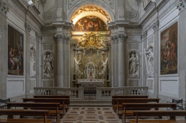 Spoleto, Italy, 25 November, 2022: altar and pews with statues and paintings inside the Spoleto Cathedral, Europe