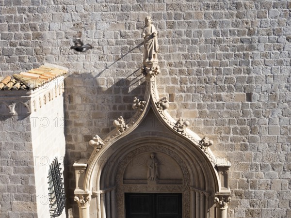 Sculpture, stone carving, figure of a saint above a church portal, Old Town of Dubrovnik, Dalmatia, Croatia, Europe