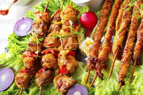 Grilled szaszlyk and meatballs with green salad
