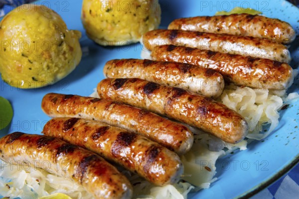 Thuringian bratwurst with sauerkraut and dumplings
