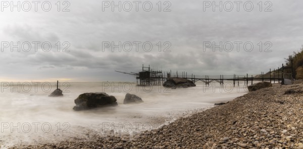 Trabocco Punto Le Morge on a rainy day under a cloudy sky long exposure on the Abruzzo Coast
