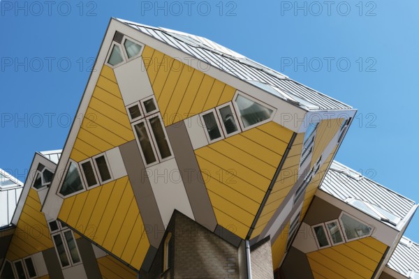 Rotterdam, Netherlands, May 8, 2022: Yellow cubic houses in Rotterdam. The Cubic Houses were designed by Piet Blom architect