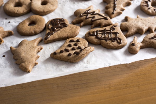 Decoration on gingerbread cookie close up. Baking with children