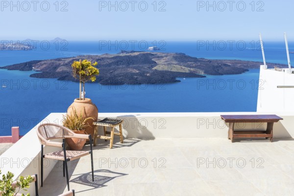 View from Fira to the volcanic island of Nea Kameni, Fira, Santorini Island, Cyclades, Greece, Europe