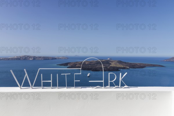 View from Fira to the volcanic island of Nea Kameni, Fira, Santorini Island, Cyclades, Greece, Europe