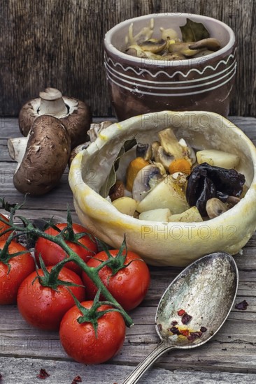 Vegetable hot plate made of baked dough cooked in a rustic style.Photo tinted