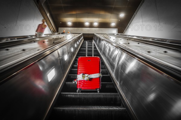 Escalator and suitcase. Shooting Location: New York, Manhattan