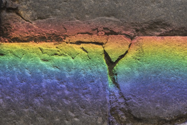 Refraction of colours on a stone - background and text space