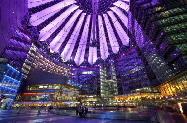 Sony Center in Berlin at night with purple lights on the ceiling