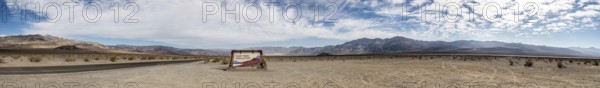 Panorama of Death Valley NP Sign with cloudy sky
