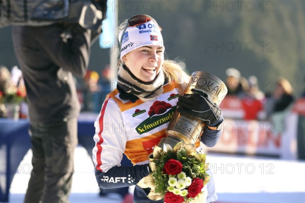 Ida Marie Hagen Norway lifts the Black Forest Cup at the award ceremony for the FIS Nordic Combined World Cup Schonach 2025, Schonach, Germany / Germany