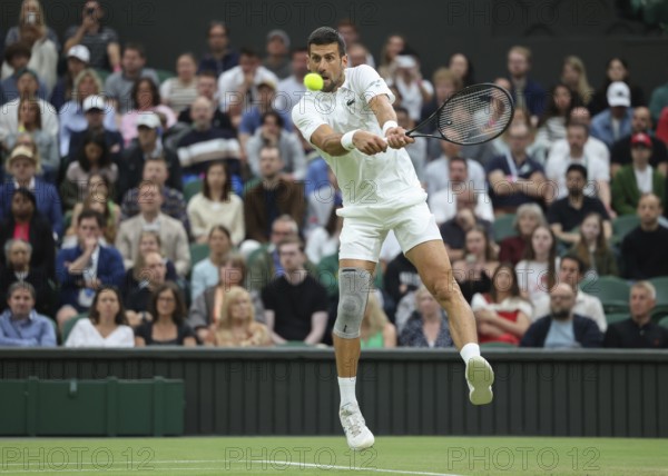 Serbian tennis player Novak Djokovic in action at the 2024 Wimbledon Championships, London, England, United Kingdom, Europe