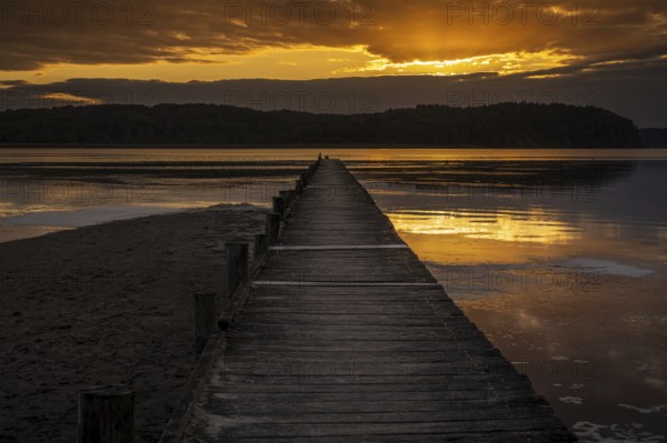 Sunset over the Jasmunder Bodden coast, with the pier in Lietzow, Mecklenburg-Western Pomerania, Germany, Europe