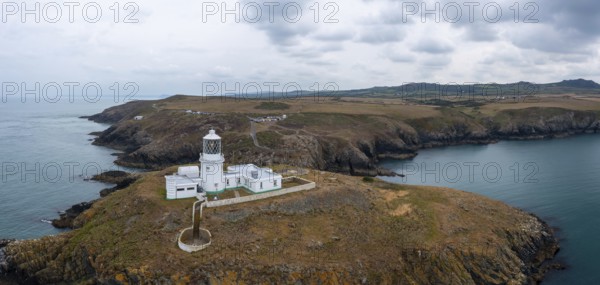 Aerial panorama landscape of the Pembrokeshire coast with the historic Strumble Head Lighthouse