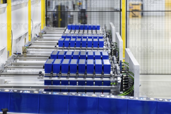 JT Energy Systems is the largest production centre for lithium-ion batteries in the intralogistics industry. On an area of 42, 000 m², lithium-ion batteries are produced and reconditioned to the highest quality standards using modern production technologies. An industrial robot assembles individual cells into battery units, Freiberg, Saxony, Germany, Europe