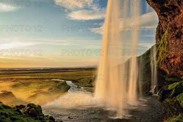 Seljalandsfoss waterfall at sunset in summertime, Iceland, Europe