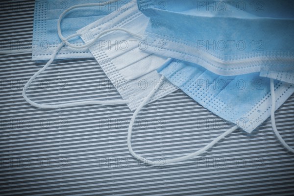 Composition of surgical sterile masks on striped background