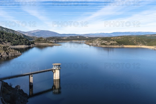 The Atazar reservoir and control tower of Dam in the mountain range of Madrid