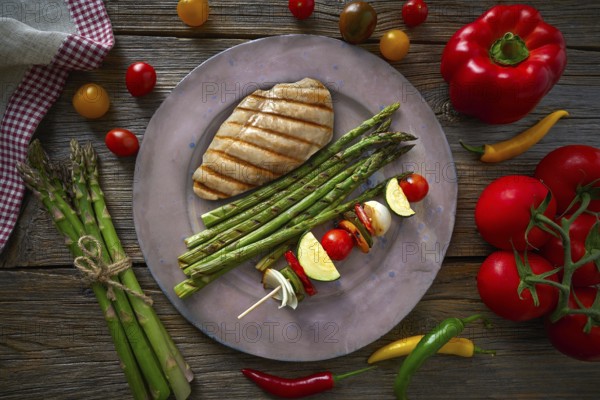 Grilled chicken breast with brochette vegetable with grill asparagus