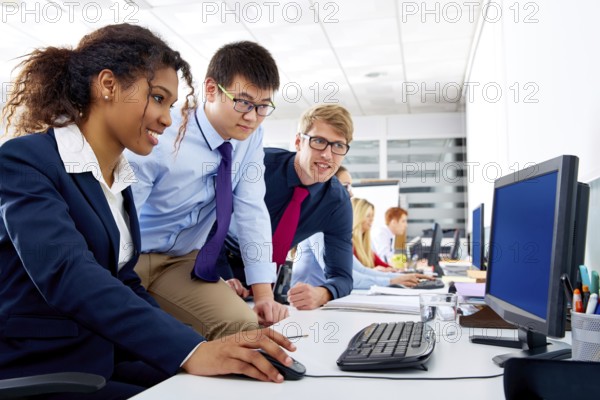 Business team young people multi ethnic teamwork in office computer