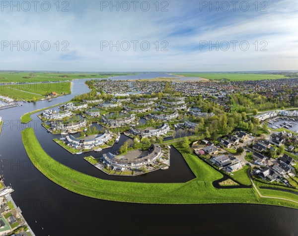 Aerial view of a modern residential area in a watery surrounding